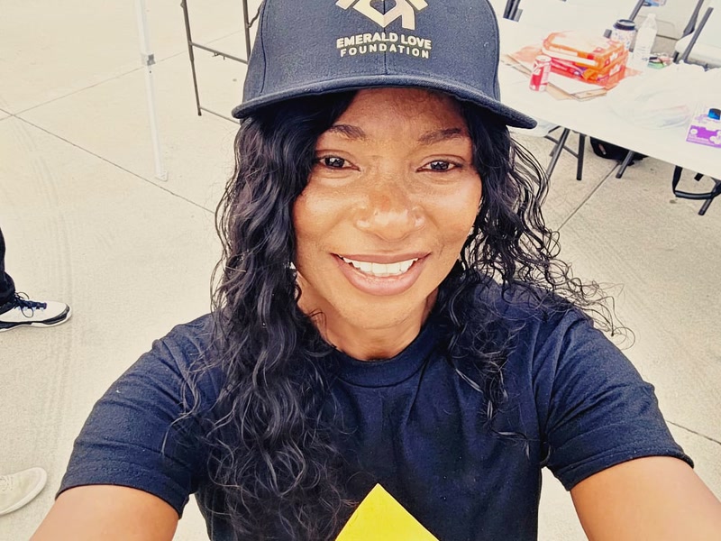 A volunteer selfie in ELF branded gear at the August outreach