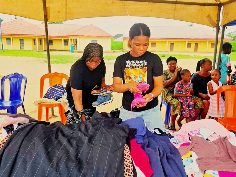 ELF volunteers preparing donated clothing for distribution to the Uyo community