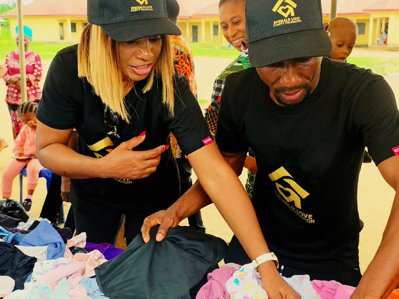 ELF volunteers selecting clothing for community members at the giveaway table